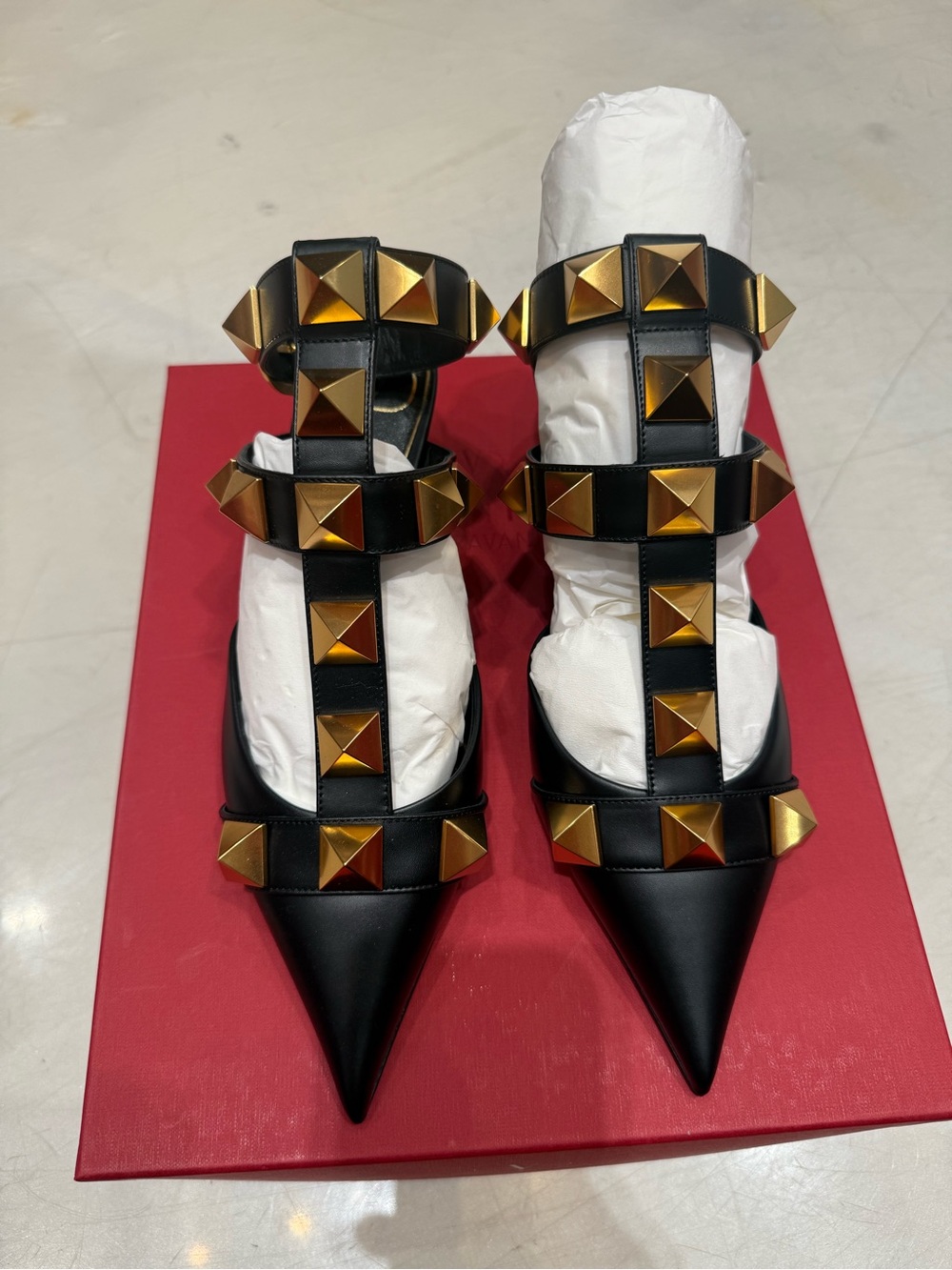 Valentino Garavani Black Leather Pointed T-Strap Heels with Gold Pyramid Studs